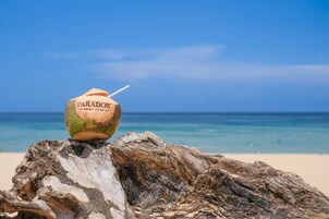 Beach nearby, white sand, beach towels, beach volleyball