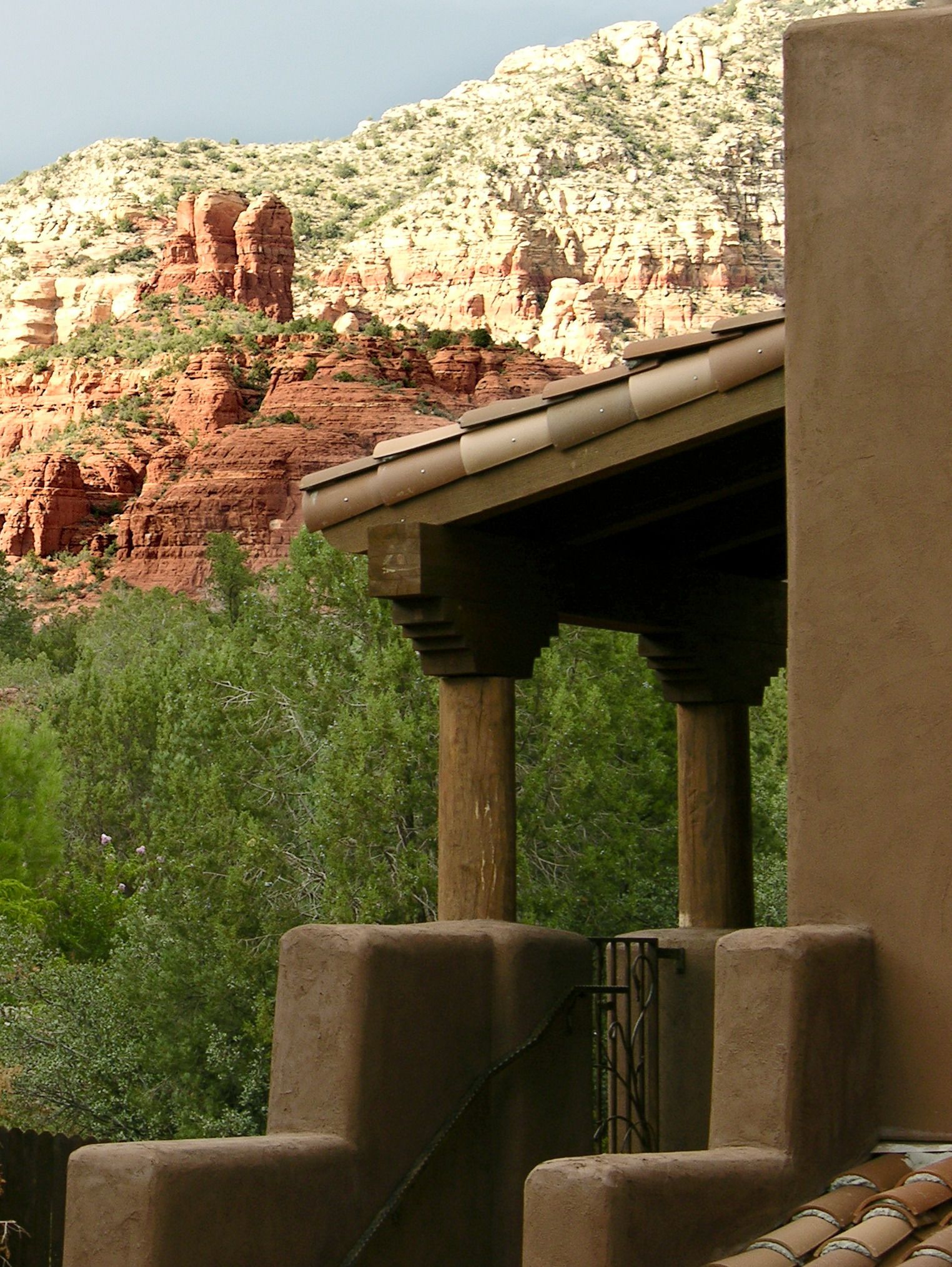 A building with a view of red rock formations in the background.