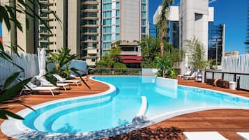 Seasonal outdoor pool, open 10:00 AM to 7:00 PM, pool umbrellas