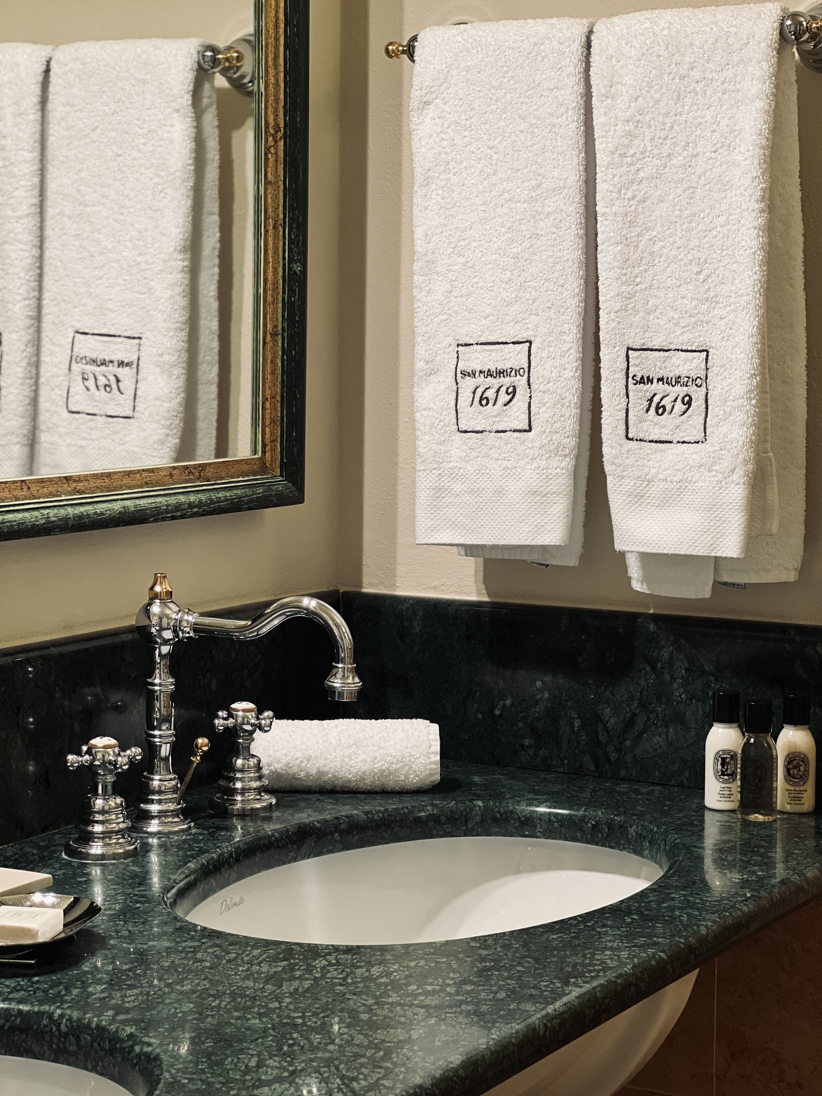 designer toiletries, hair dryer, bathrobes, slippers