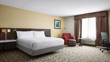 Premium bedding, desk, laptop workspace, blackout drapes