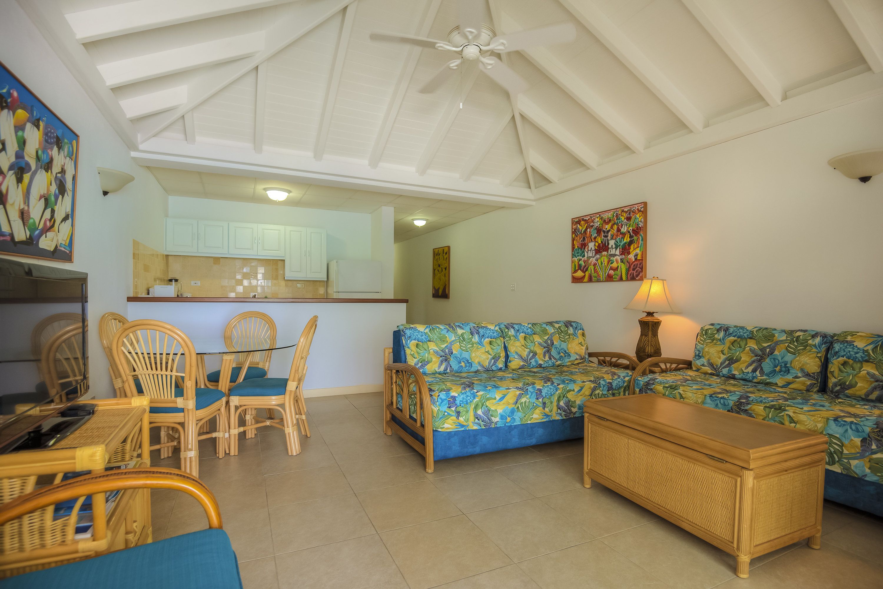 deluxe room, 1 bedroom, beach view, oceanfront | living area | flat-screen tv, dvd player
