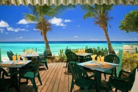 Breakfast, lunch, dinner served; ocean views. Coral Mist Beach Hotel