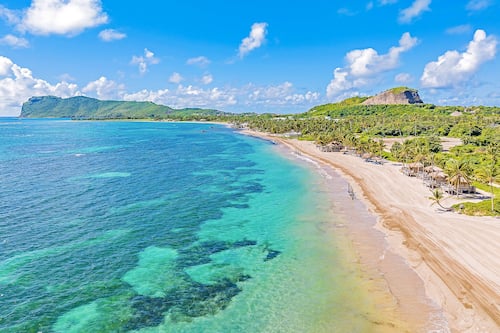 On the beach, sun-loungers, beach umbrellas, beach towels