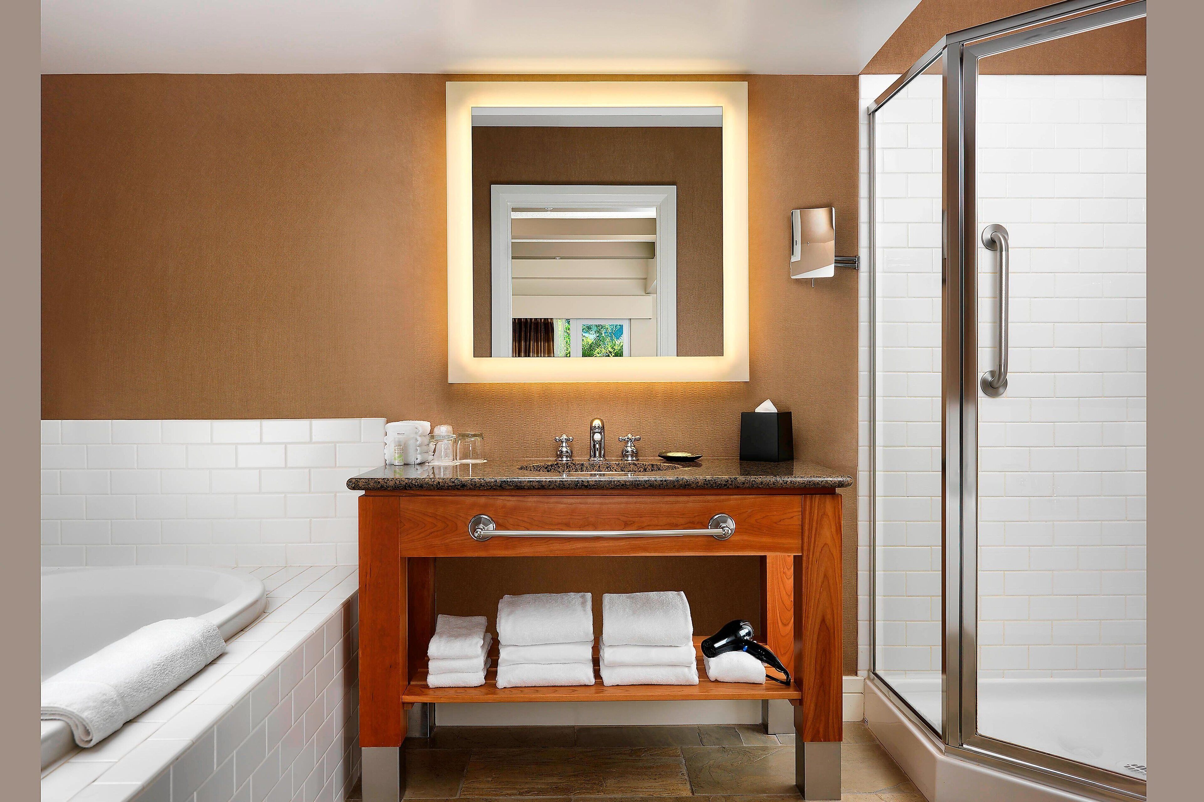 separate bathtub and shower, deep-soaking bathtub, rainfall showerhead