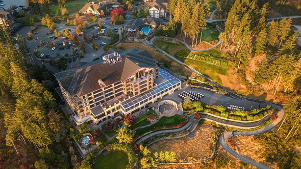 An aerial view of a hotel with a central building, parking lot, and landscaped areas. - The Westin Bear Mountain Golf Resort & Spa, Victoria (Victoria)
