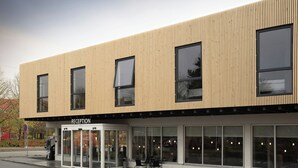 A modern building with a reception area, large windows, and a wooden facade. - Four Points Flex by Sheraton Copenhagen Airport (Kastrup)