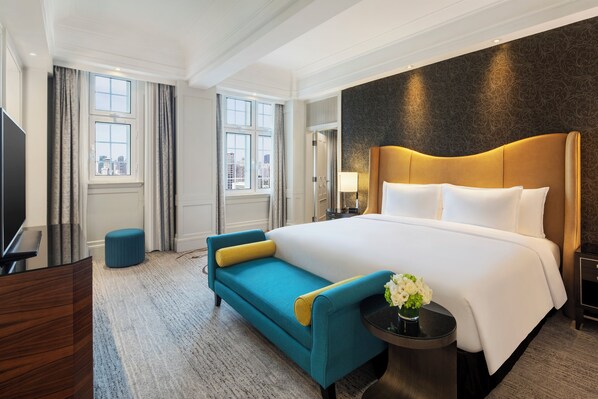 Suite Deluxe | Edredón, minibar, caja de seguridad en la habitación y escritorio 