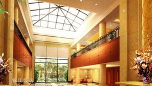 A spacious lobby with a high ceiling, large windows, and a central atrium. - Jin Jiang Hotel Shanghai (Shanghai)
