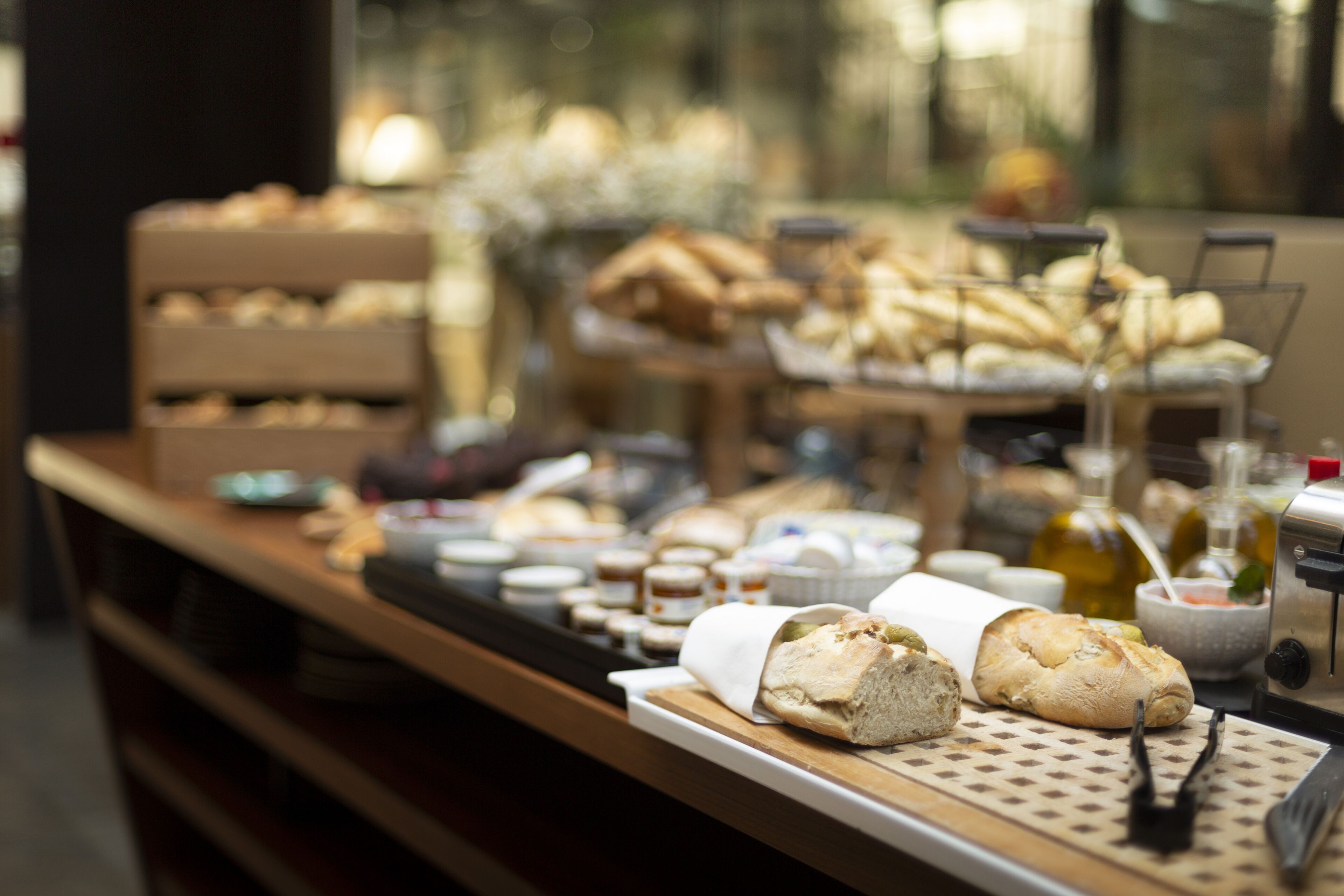 A buffet with various food items and condiments.