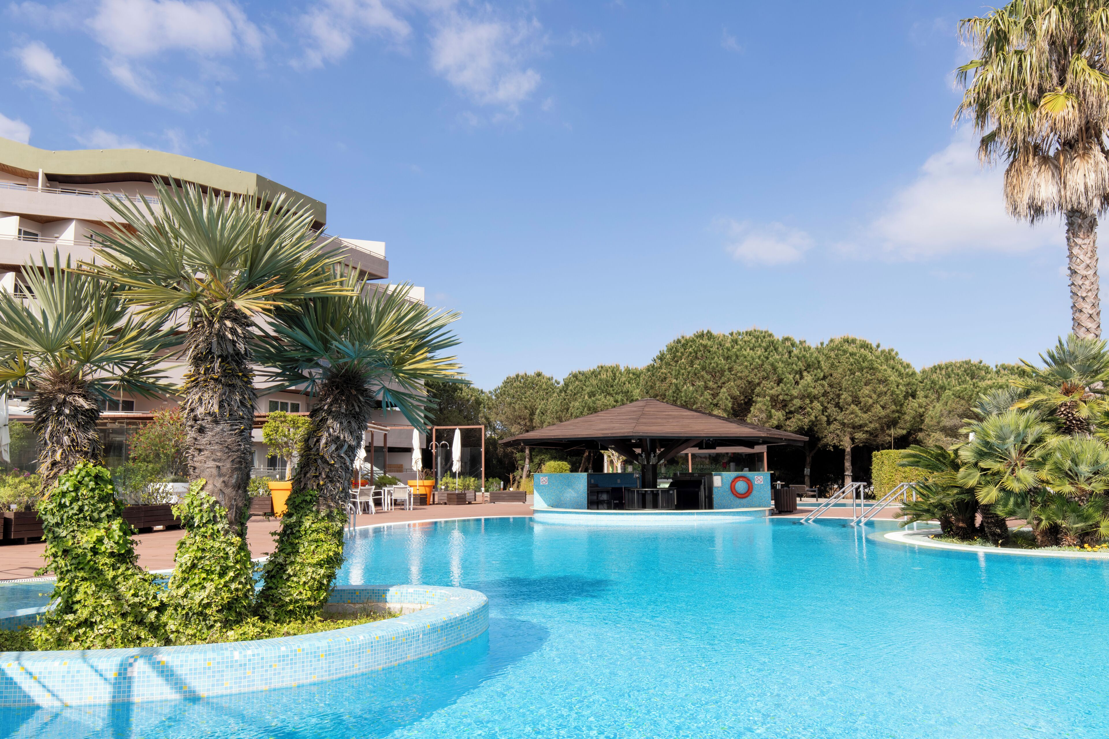 Indoor pool, outdoor pool, pool umbrellas, pool loungers