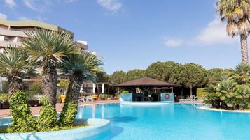 Indoor pool, outdoor pool, pool umbrellas, pool loungers