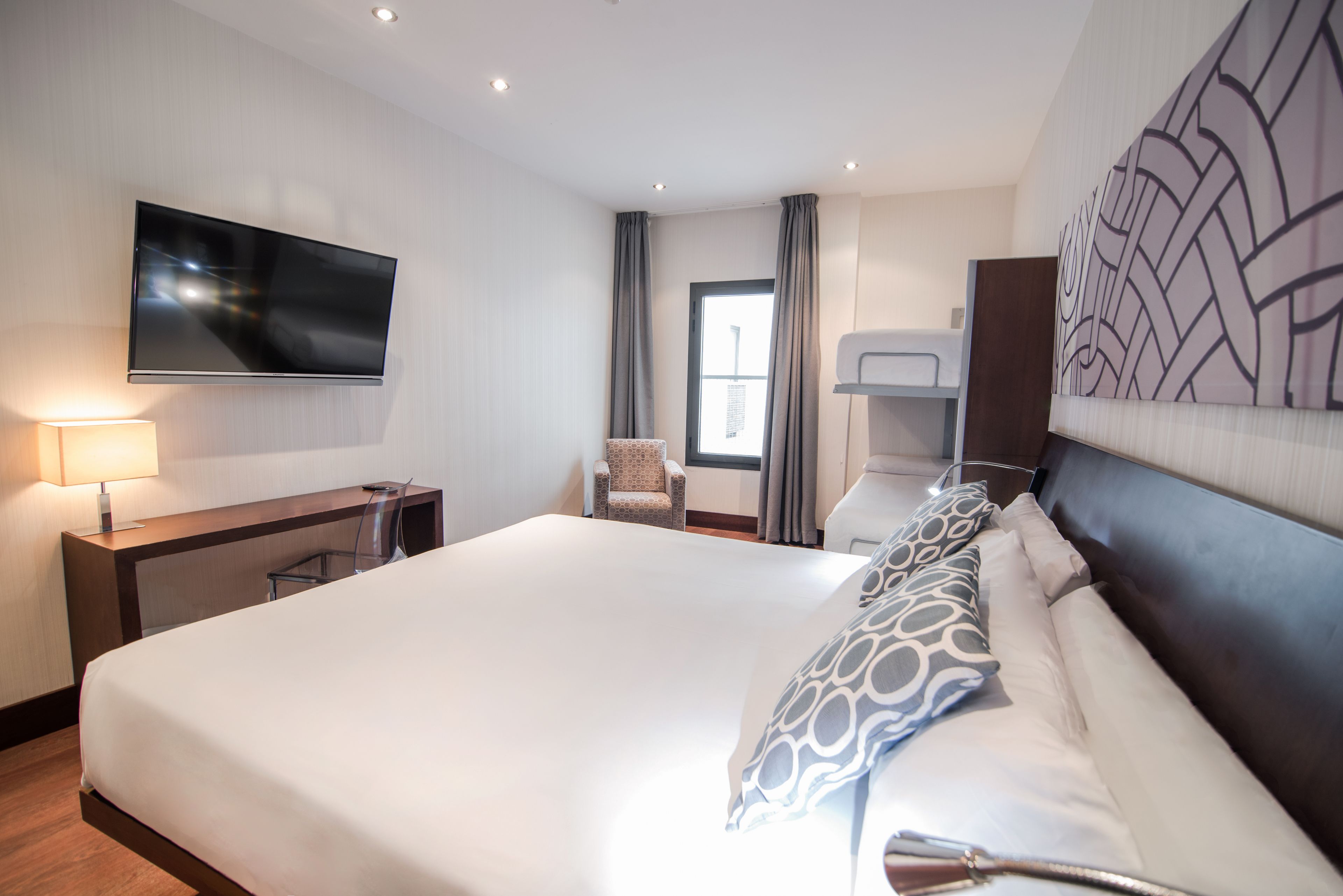 quadruple room | minibar, in-room safe, desk, blackout curtains