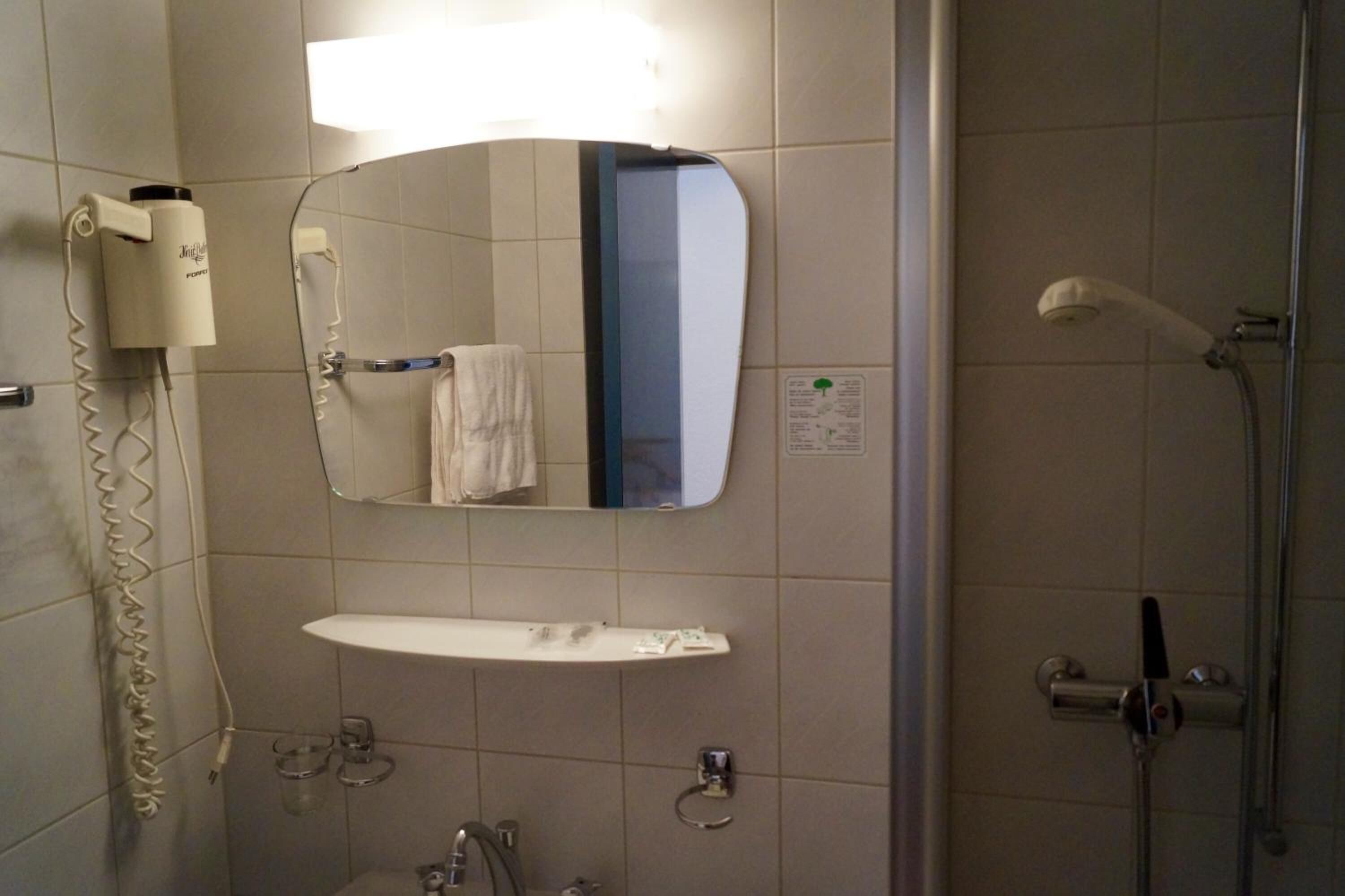 bathtub, free toiletries, hair dryer, towels