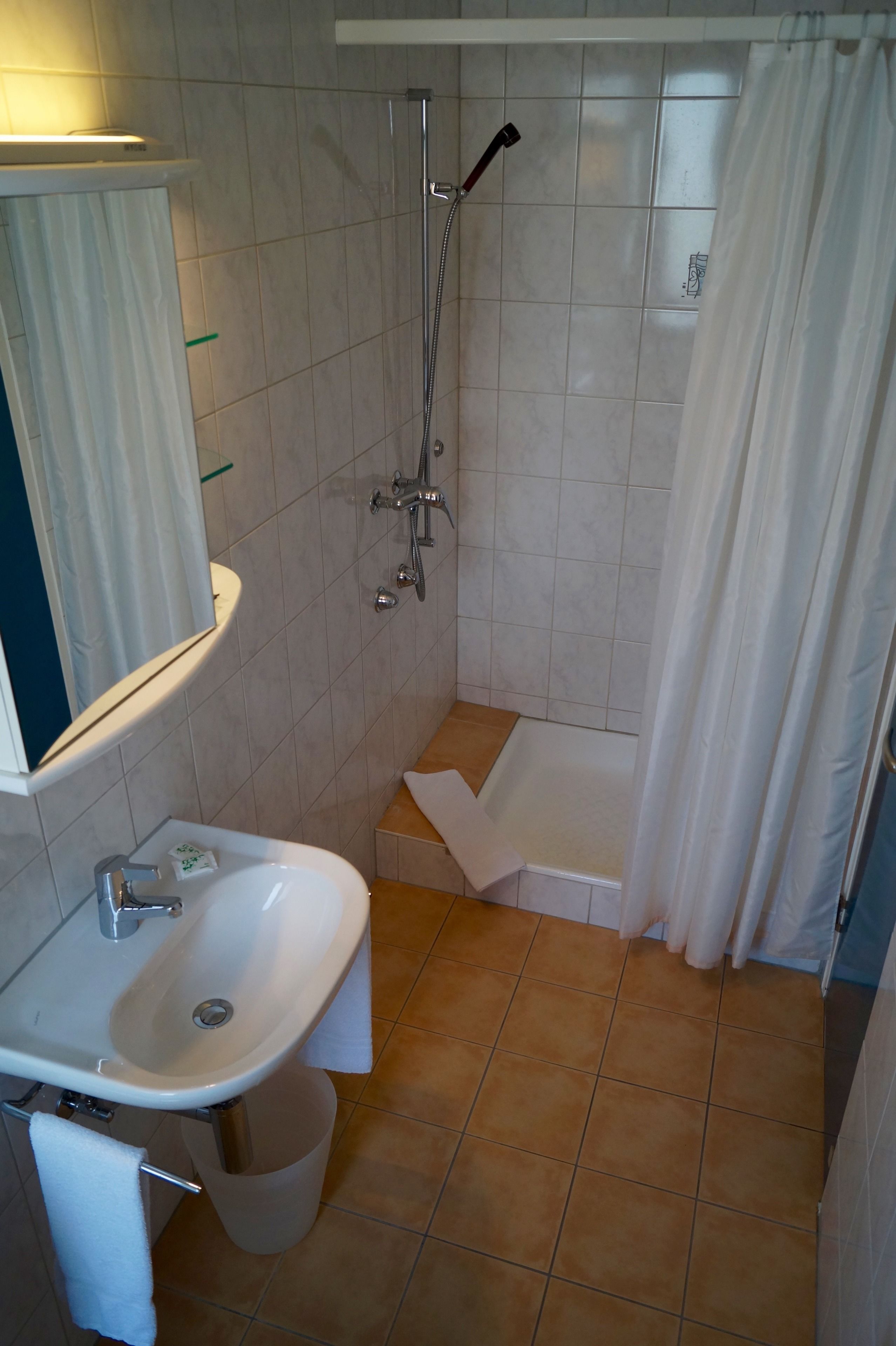 bathtub, free toiletries, hair dryer, towels