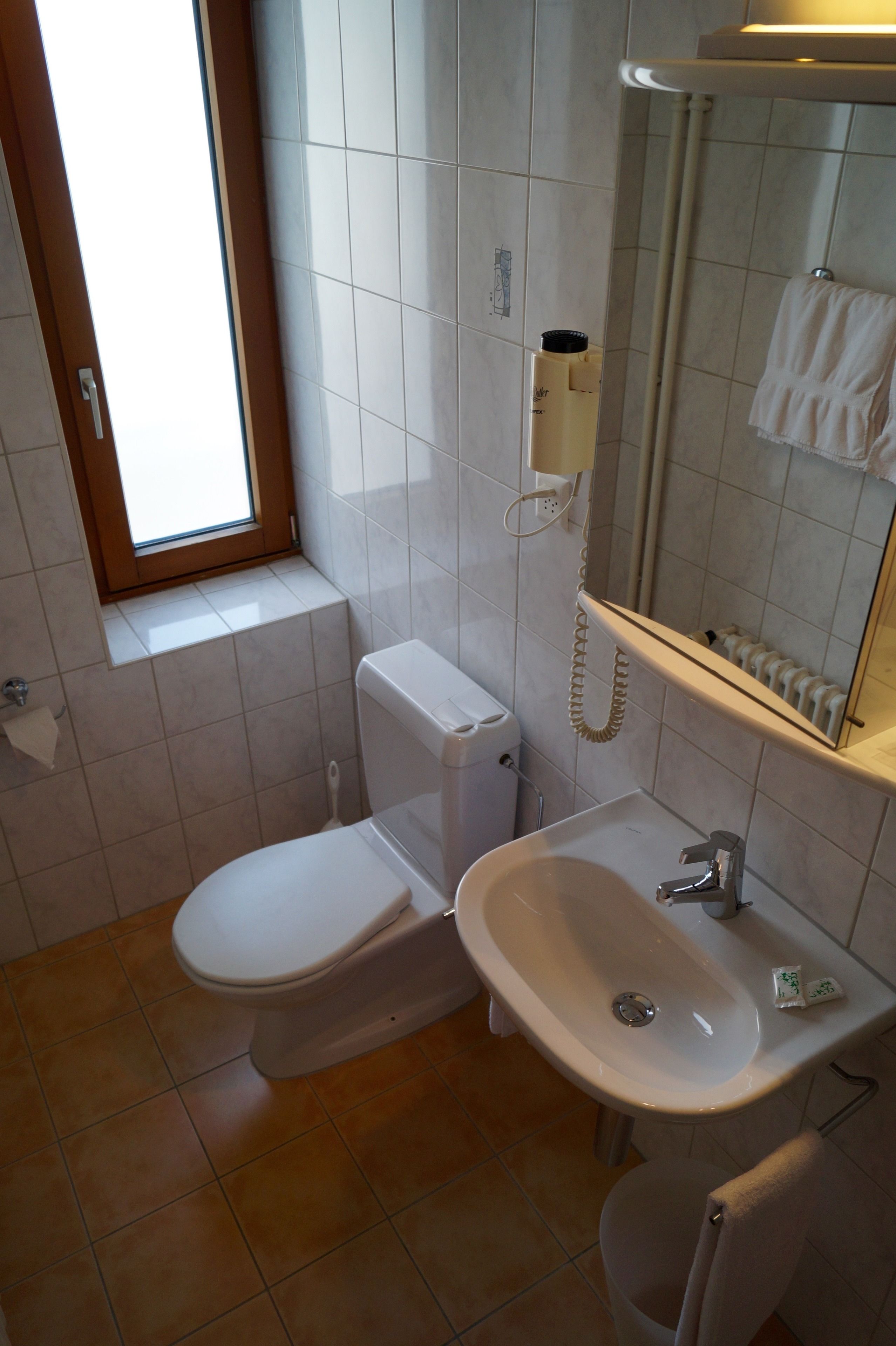 bathtub, free toiletries, hair dryer, towels