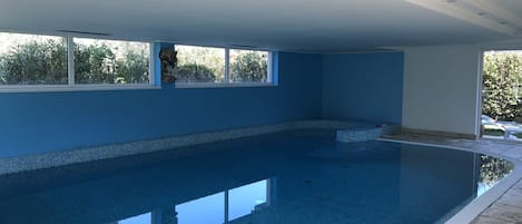 Indoor pool, outdoor pool, pool umbrellas, pool loungers