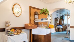 A breakfast buffet with various food items and a coffee station. - Pension Dr. Geissler (Vienna)