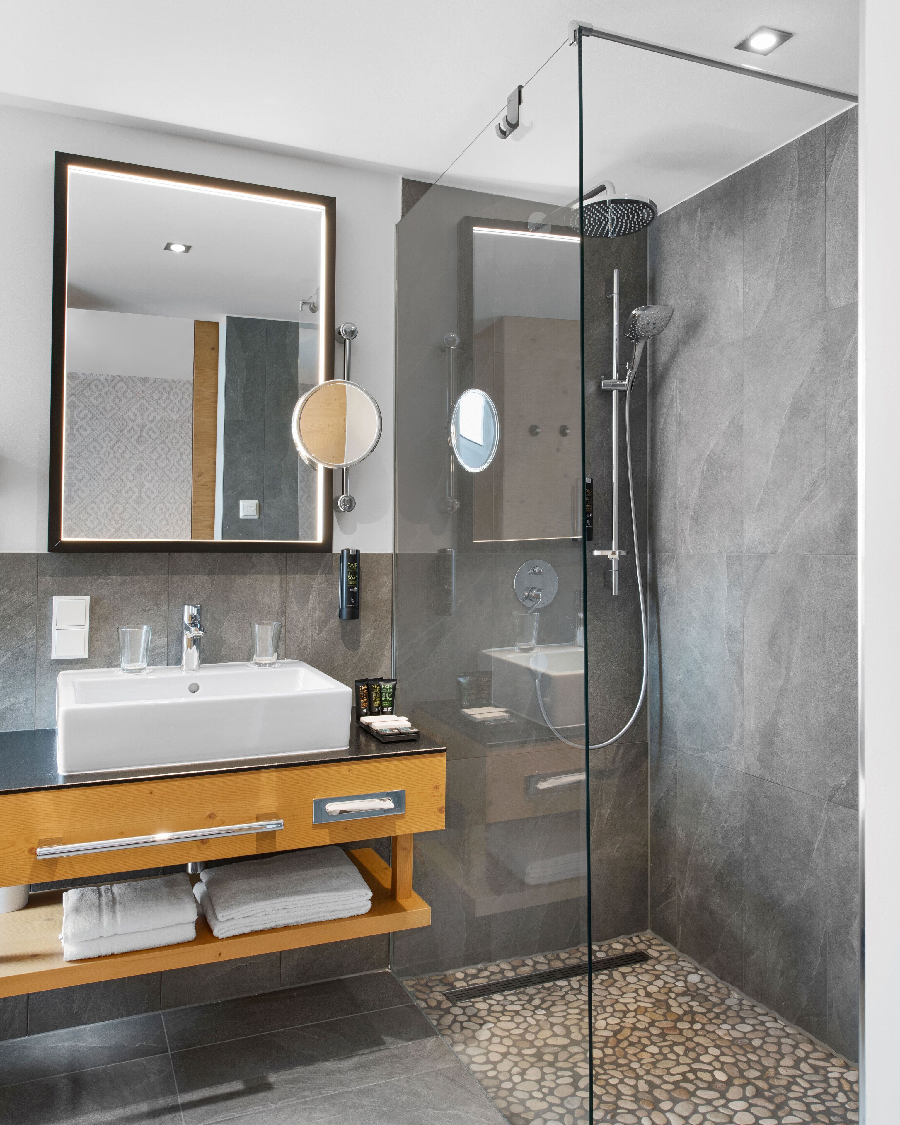 deluxe double room (alpenchic) | bathroom | shower, rainfall showerhead, free toiletries, hair dryer