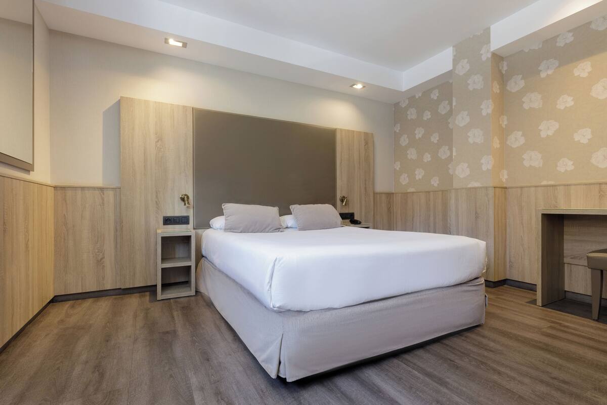 Down comforters, pillowtop beds, in-room safe, desk