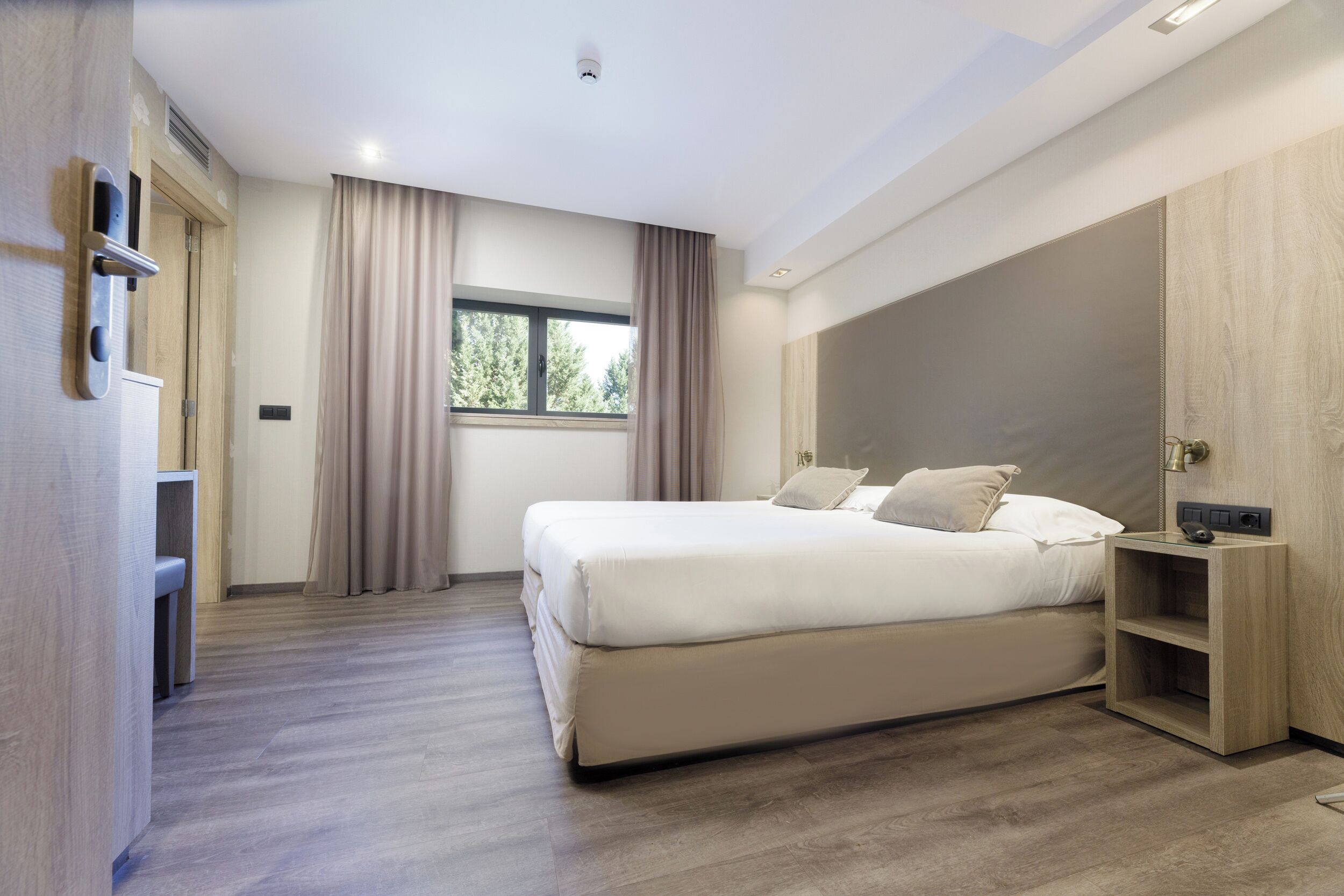 Down comforters, pillowtop beds, in-room safe, desk