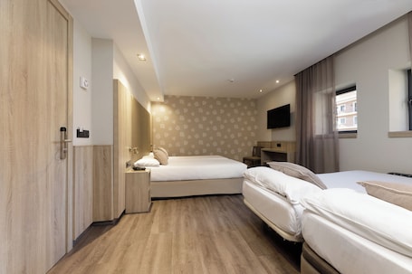 Quadruple Room | Down comforters, pillowtop beds, in-room safe, desk