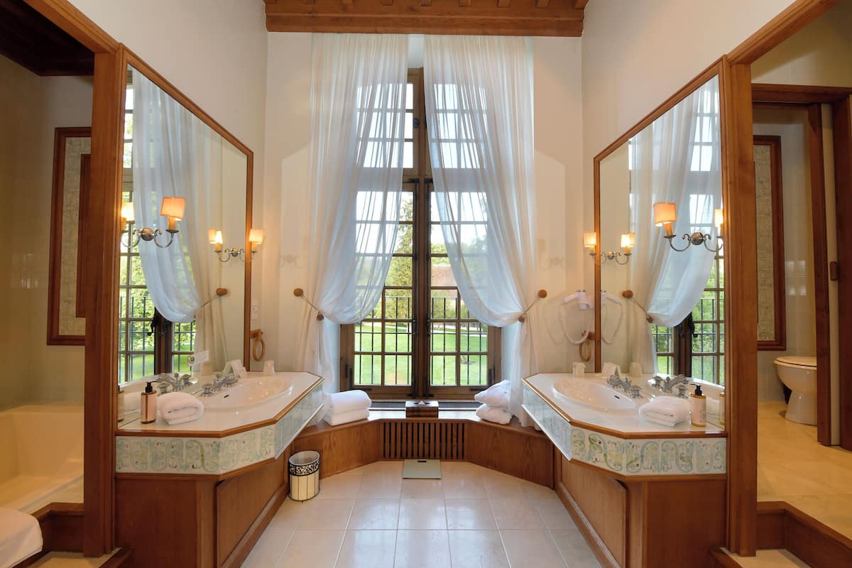 grand double room, 1 king bed, garden area | bathroom | designer toiletries, hair dryer, bathrobes, slippers