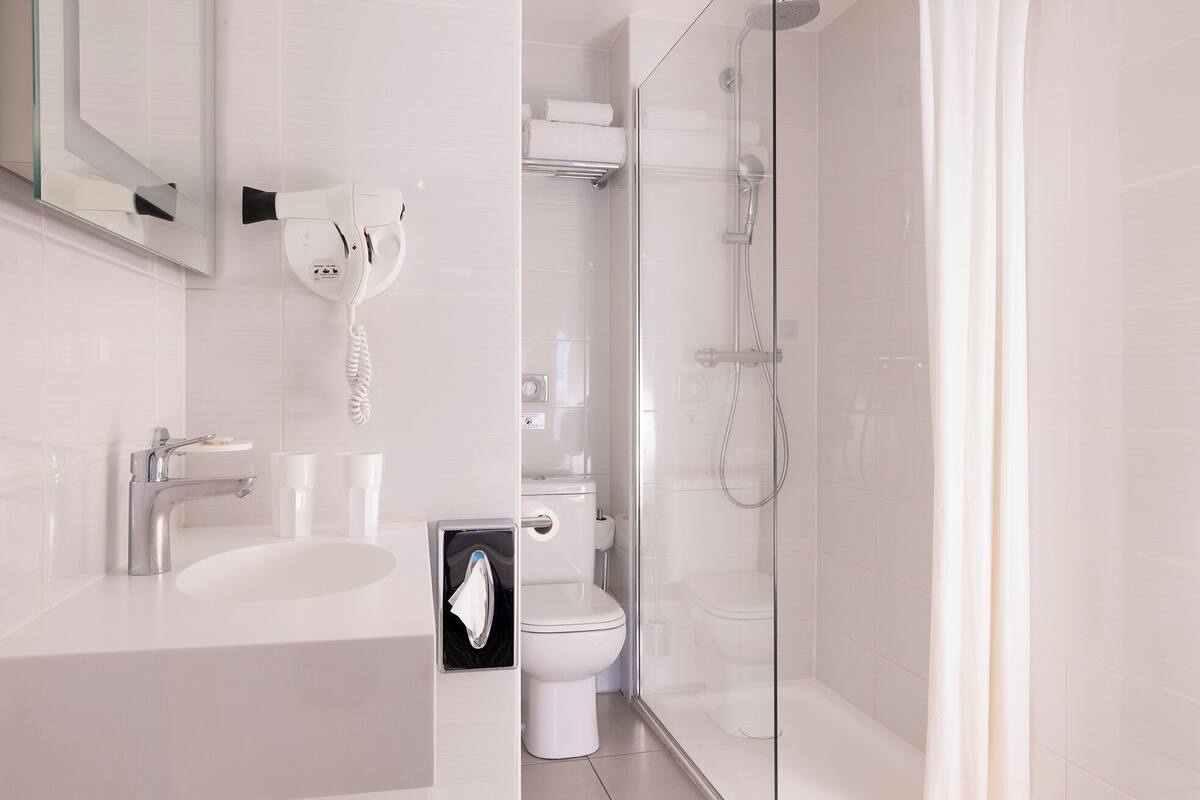 shower, rainfall showerhead, designer toiletries, hair dryer