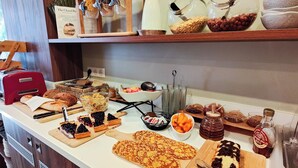 A kitchen counter with various food items and utensils. - Hôtel de France, un hôtel AMMI (Nice)