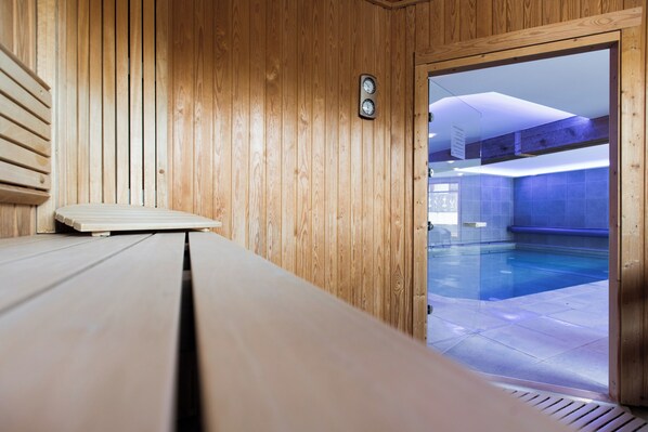 Indoor pool, open 10:00 AM to 8:00 PM, pool loungers