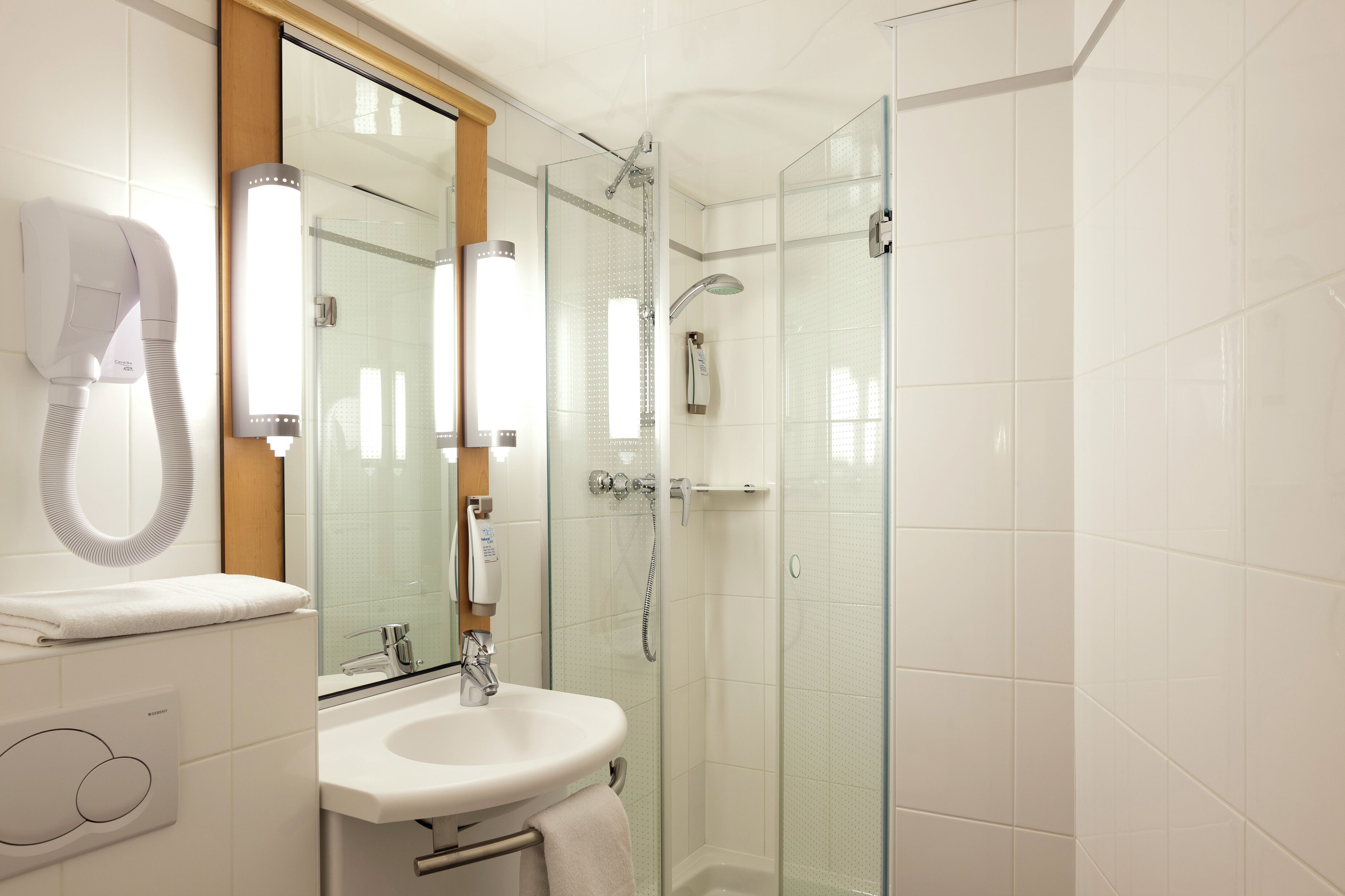 Shower, eco-friendly toiletries, hair dryer, towels