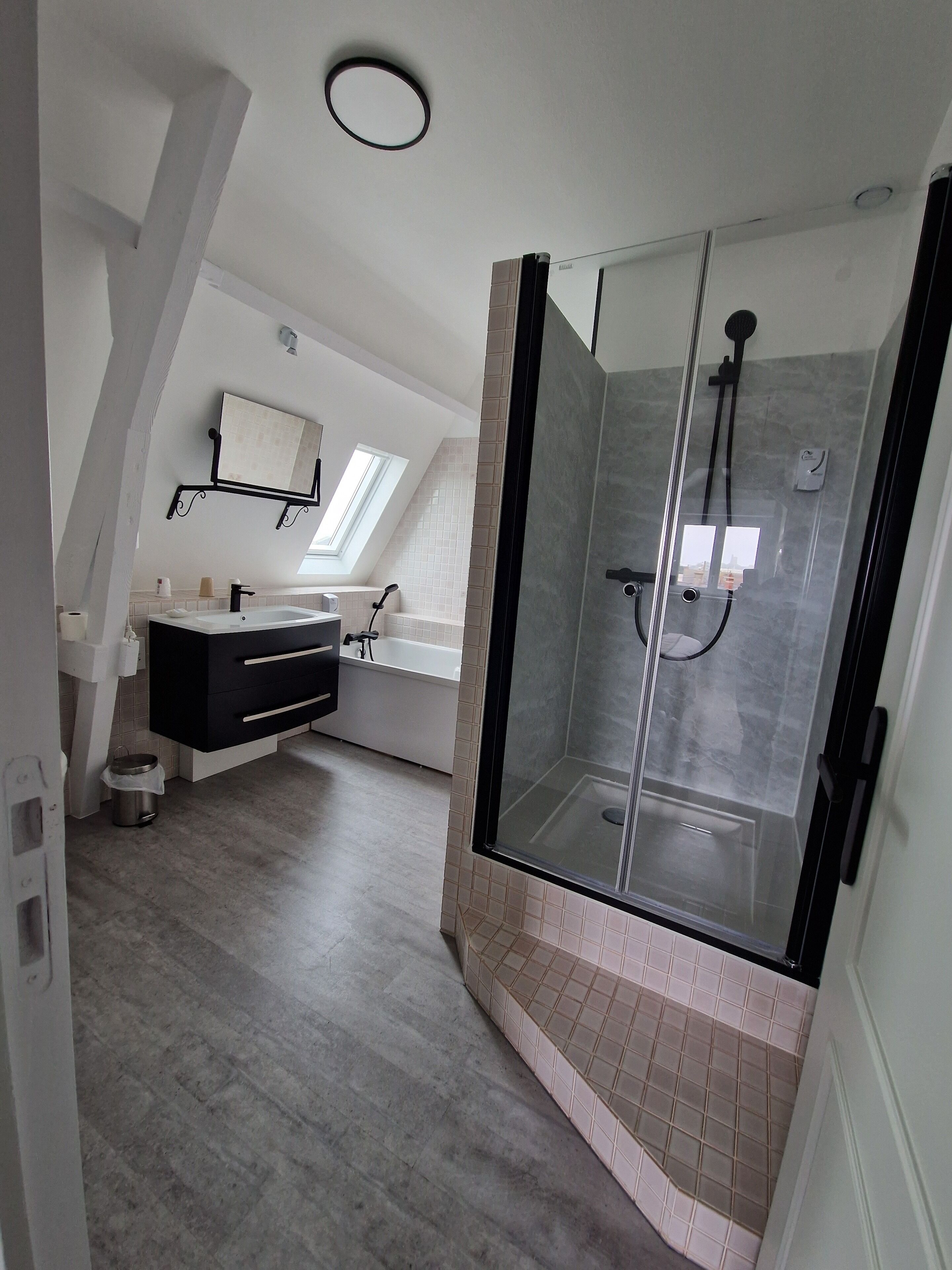 superior suite | bathroom | shower, hair dryer, towels