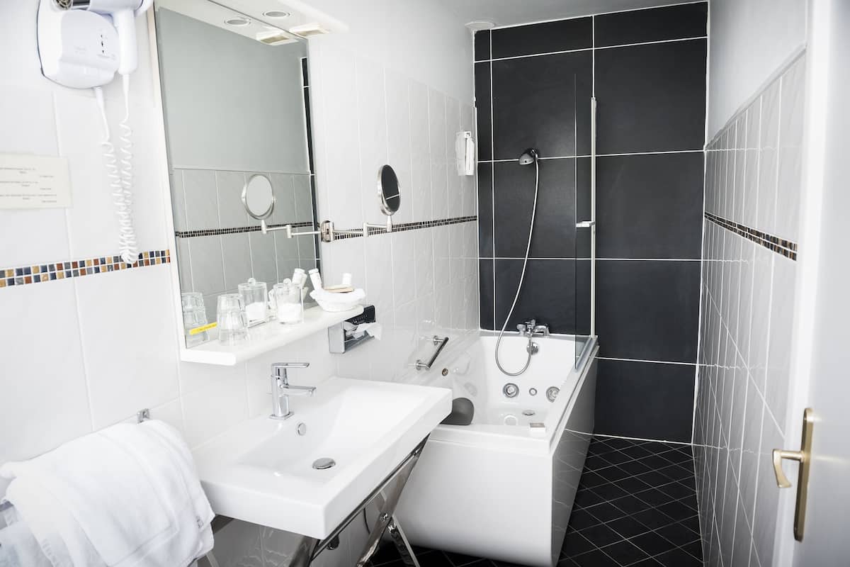 superior double room, 1 double bed | bathroom | jetted bath, free toiletries, hair dryer, bathrobes