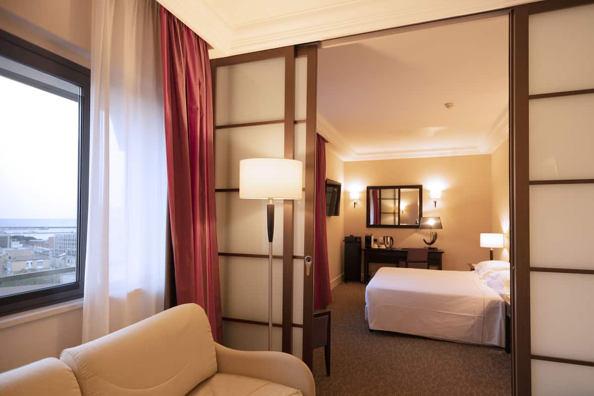 quadruple room | premium bedding, minibar, in-room safe, desk