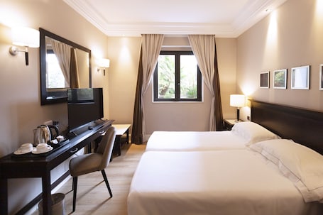 Ropa de cama de alta calidad y minibar . Regina Margherita Hotel