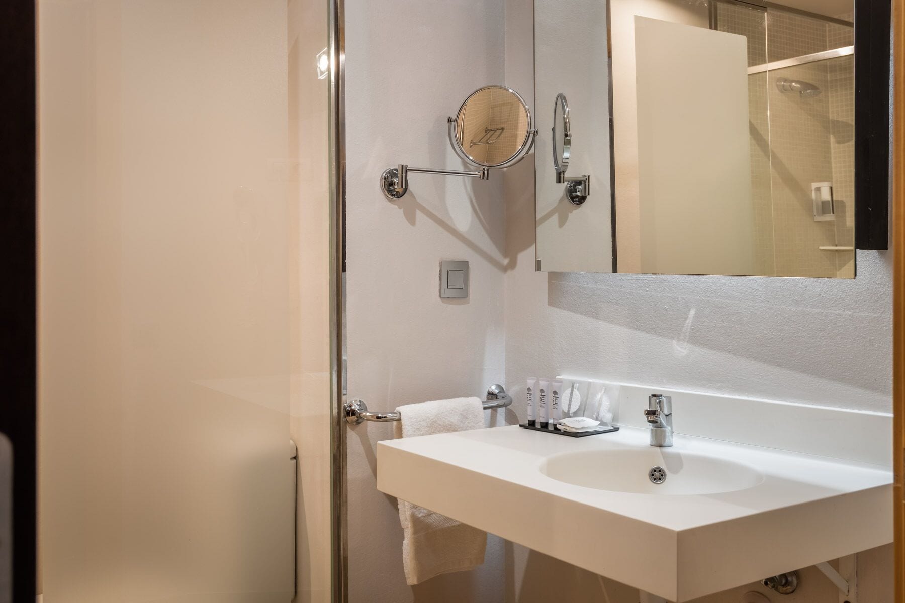 eco-friendly toiletries, hair dryer, slippers, towels