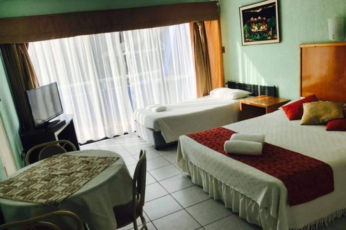 Triple Room, Multiple Beds, Kitchen | Desk, iron/ironing board, bed sheets