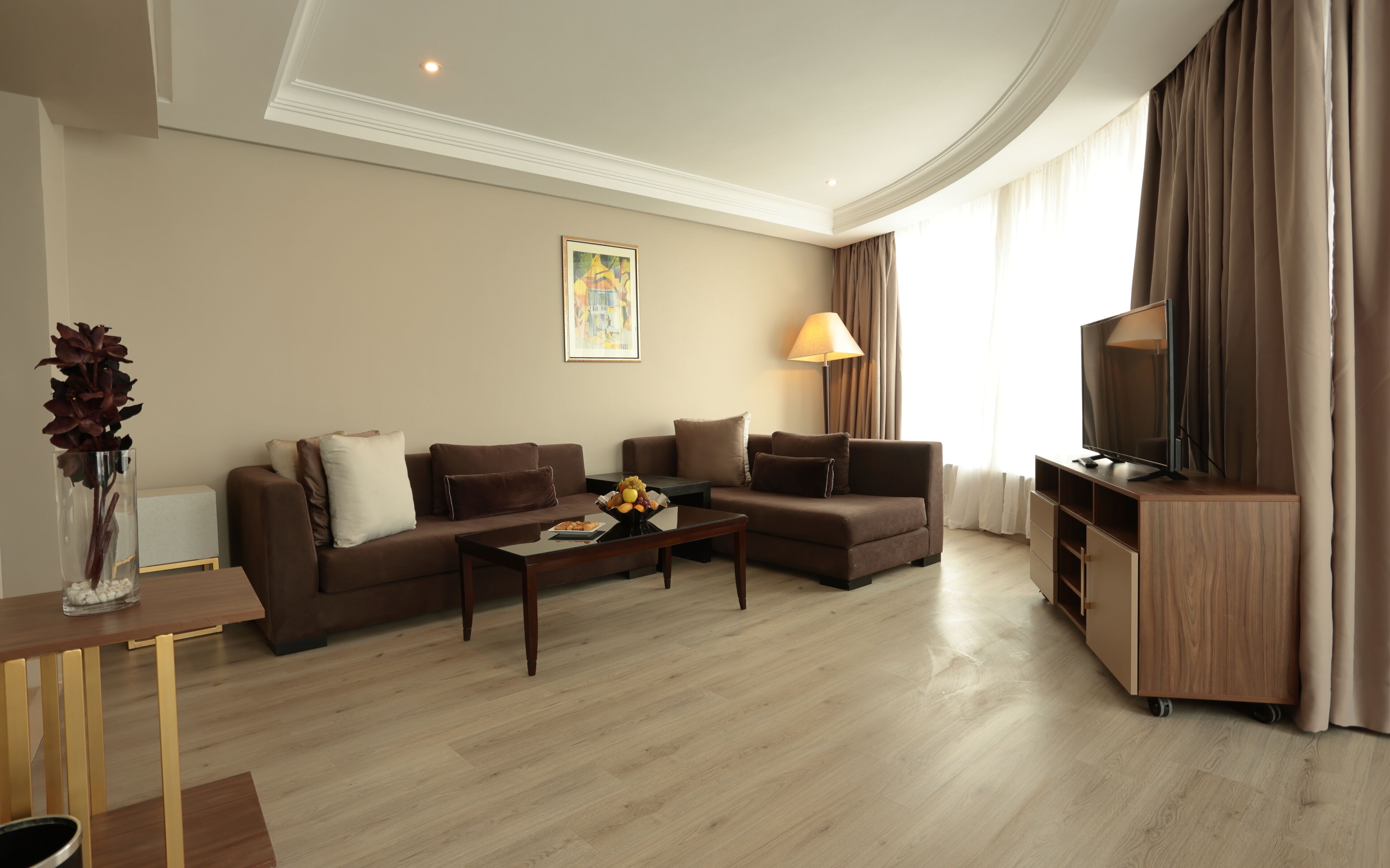 signature suite | living area | 32-inch lcd tv with satellite channels, tv