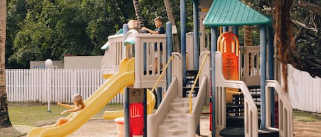 A playground with slides and climbing structures.