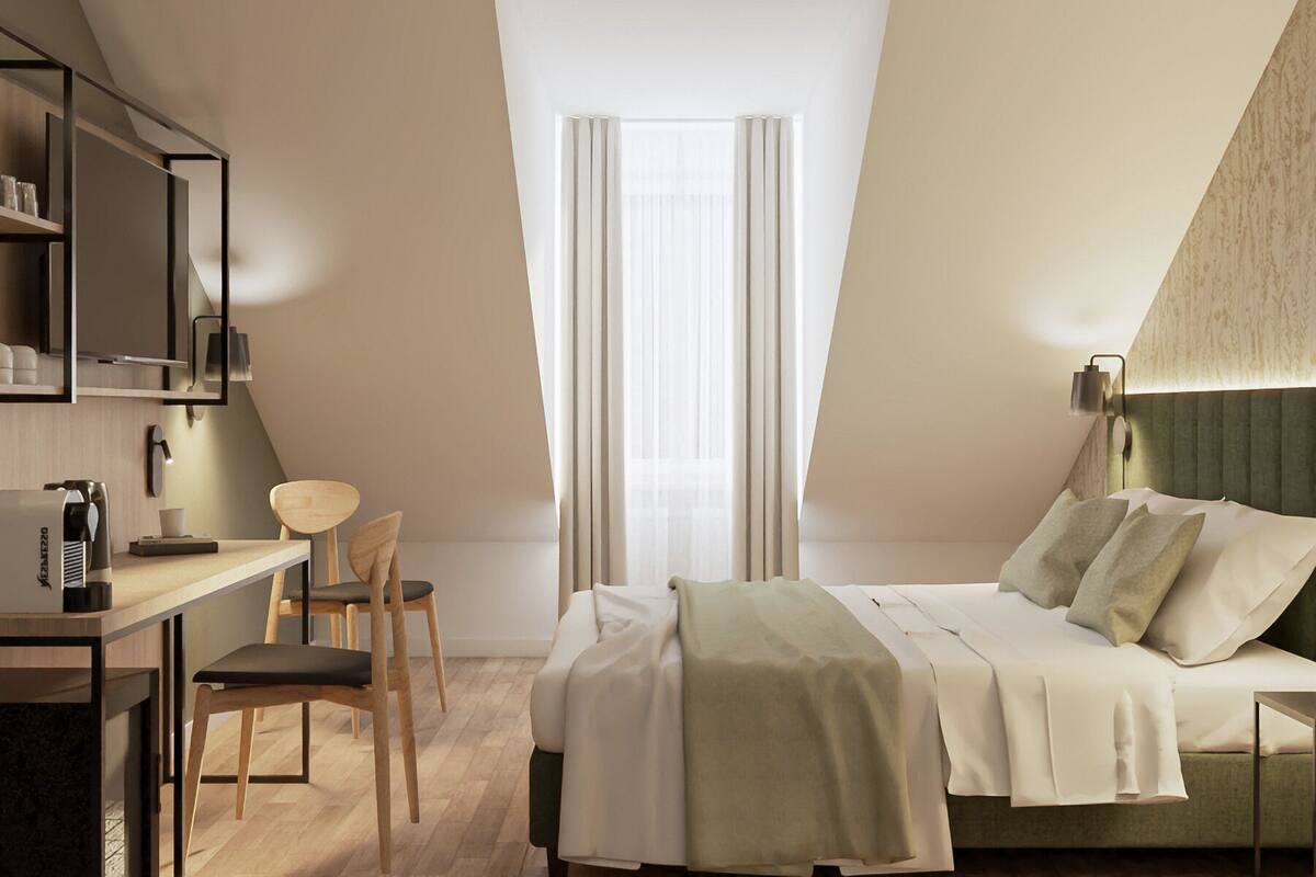 Un dormitorio moderno con cama, escritorio y silla.