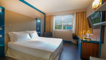 Superior Triple Room | In-room safe, individually decorated, desk, blackout drapes