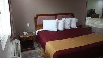 King Jacuzzi Suite - Non Smoking | Desk, blackout drapes, iron/ironing board, free WiFi