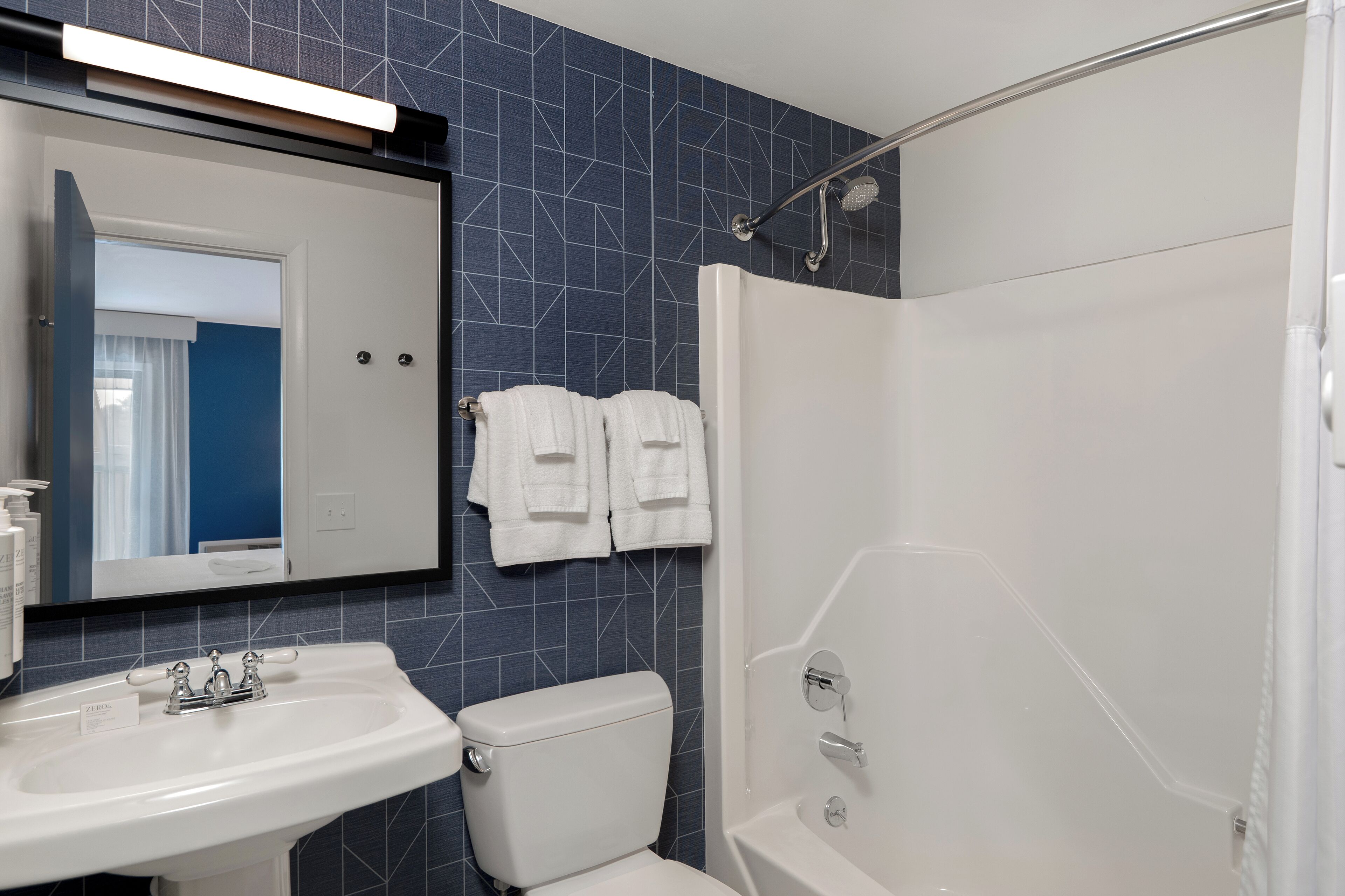 combined shower/bathtub, free toiletries, hair dryer, towels