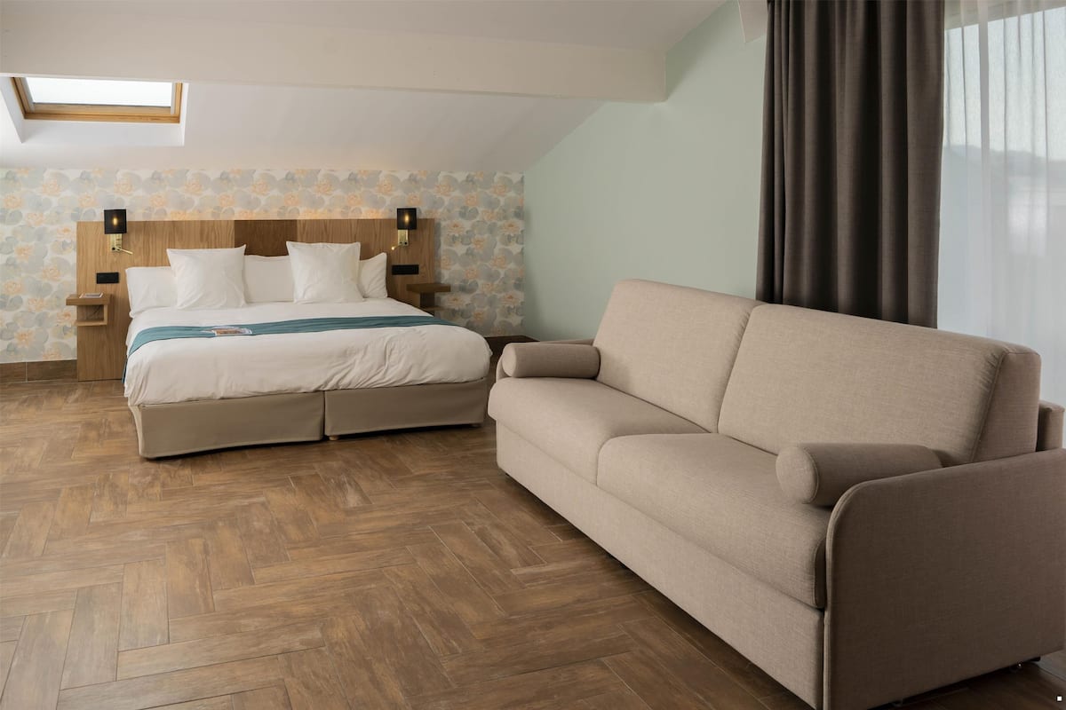 Suite, 1 King Bed, Non Smoking (Living Room;with Sofabed) | 1 bedroom, in-room safe, individually decorated, desk