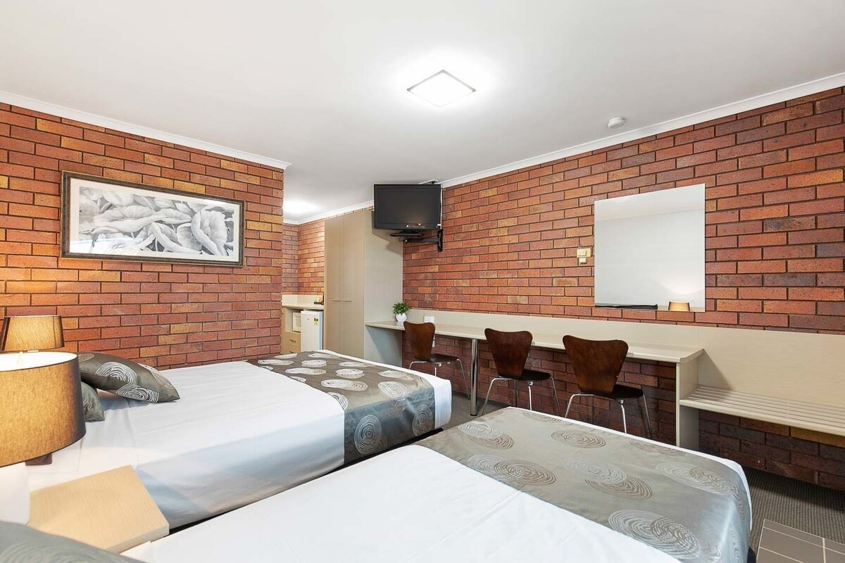 Blackout drapes, iron/ironing board, WiFi (free), alarm clocks