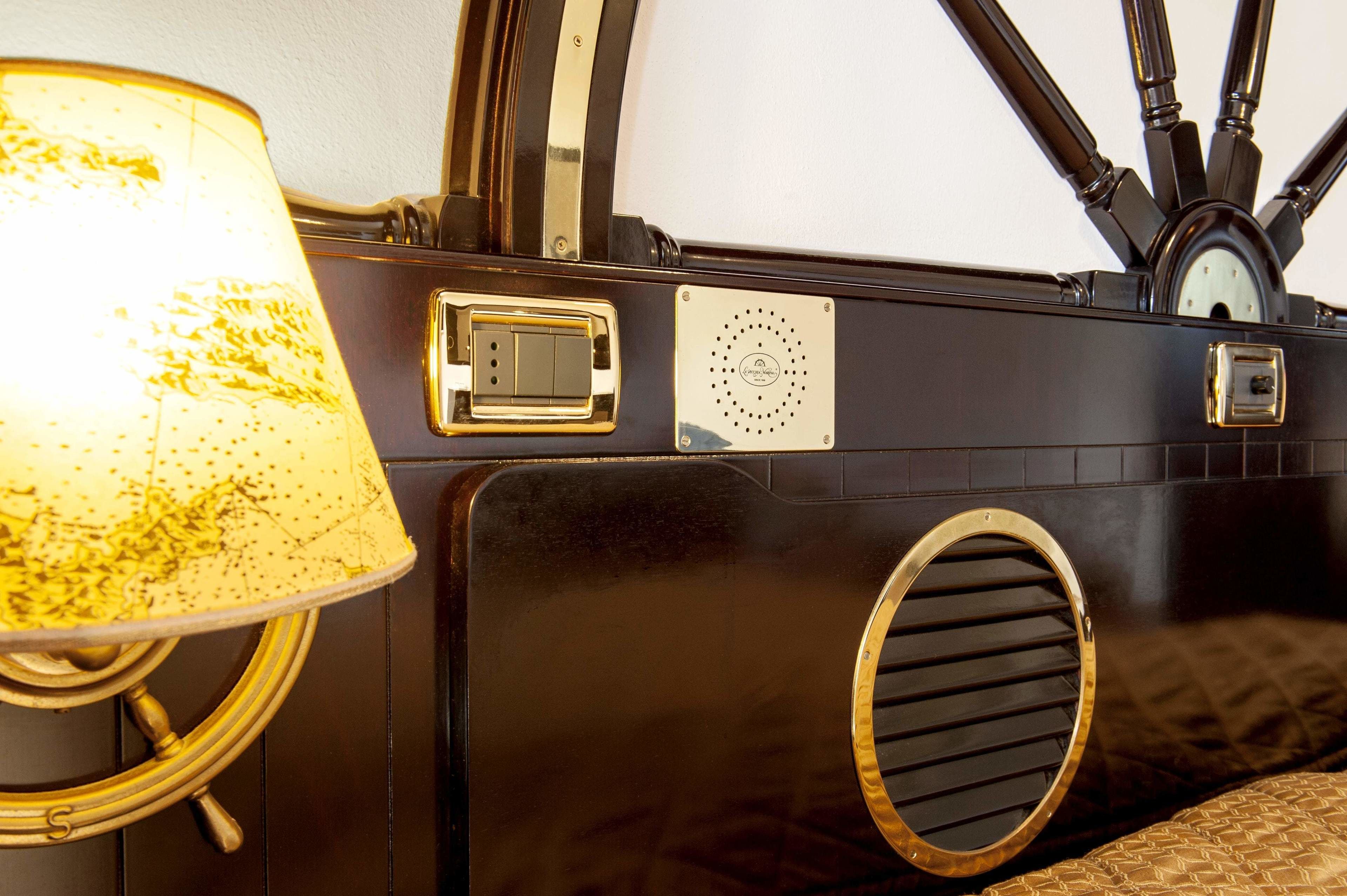 A vintage radio with a dial, a speaker grille, and a power switch.