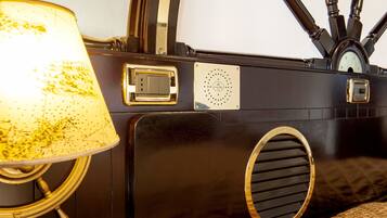 A vintage radio with a dial, a speaker grille, and a power switch.