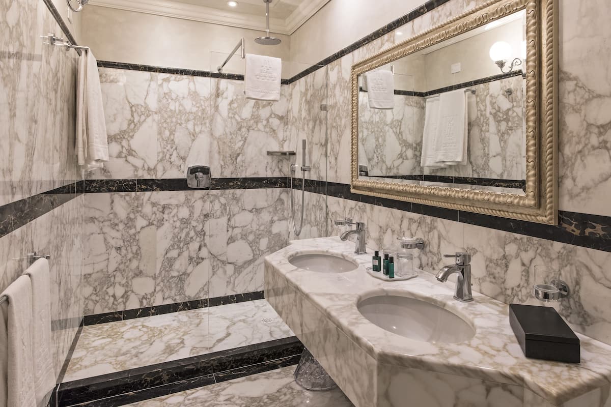 suite | bathroom | shower, rainfall showerhead, designer toiletries, hair dryer