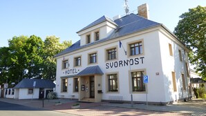 A two-story building with the sign "HOTEL SVORNOST" on the facade.