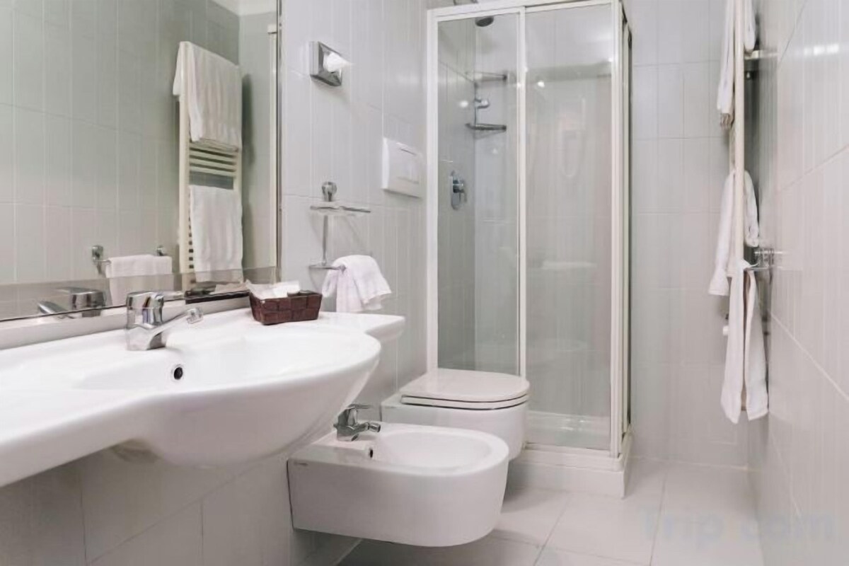 Shower, free toiletries, hair dryer, slippers
